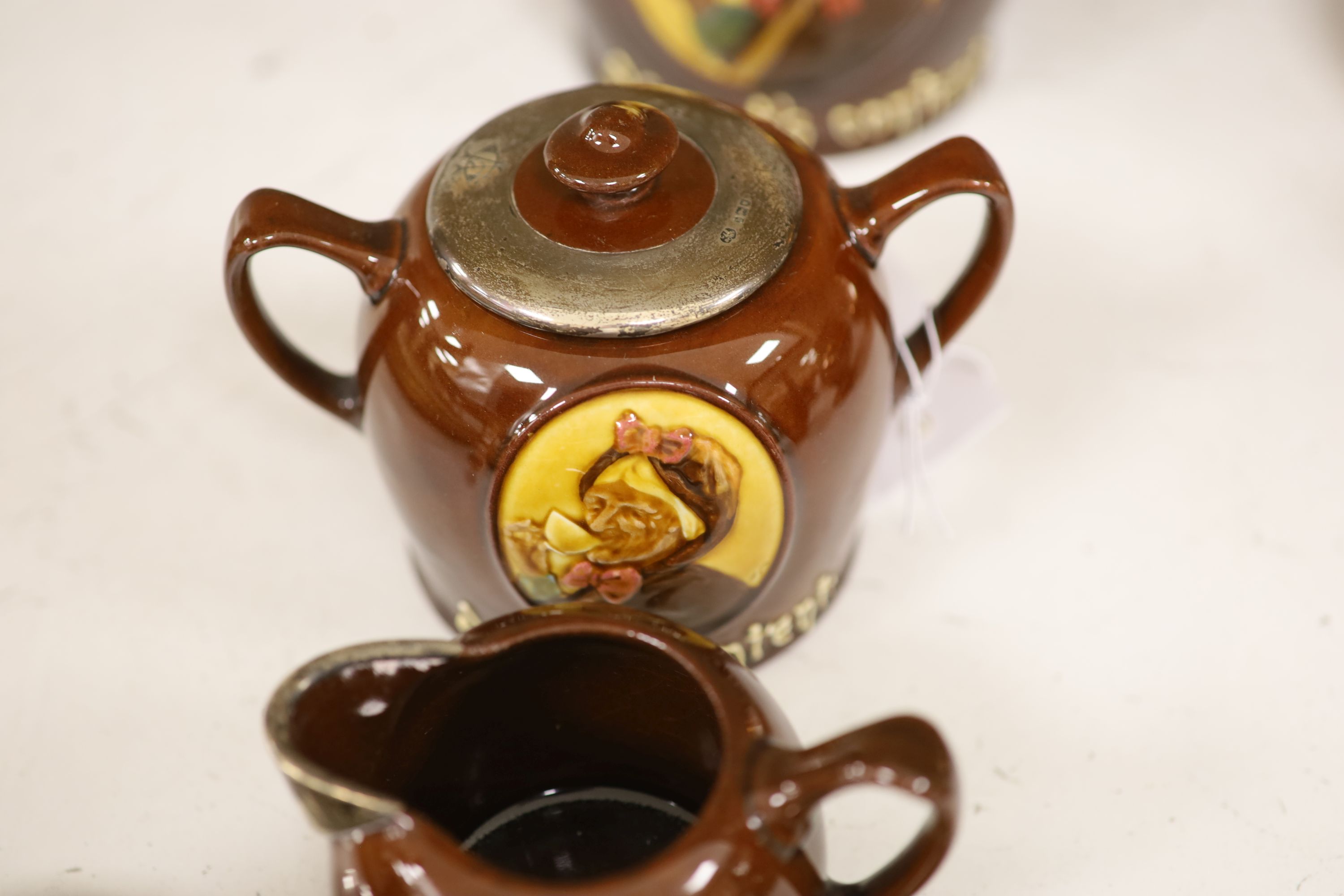 A Royal Doulton silver mounted Hearts Content tea service, and a Doulton Japanese inspired silver mounted jug, assorted lustre jugs